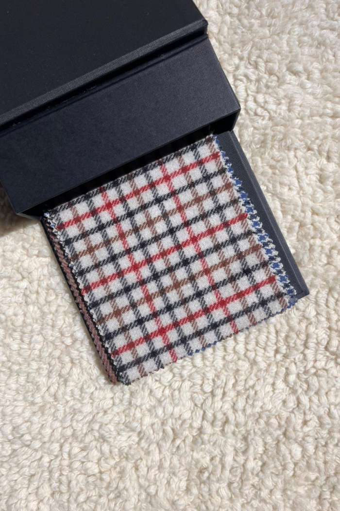 cream base with red and black check